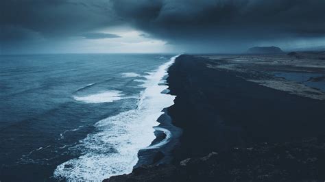Aerial View Of Ocean Waves Black Sea Sand Under Black Clouds White Sky