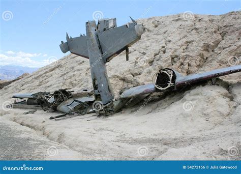 Old Plane Crash Slowly Dissolves In The Forest Stock Photo