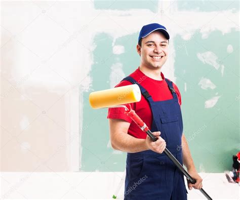 Friendly Painter At Work In An Apartment — Stock Photo © Minervastock