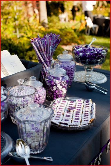 a table topped with lots of purple candies
