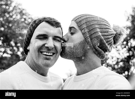 Happy Mature Gay Men Couple Taking Selfie Kissing In Winter Time