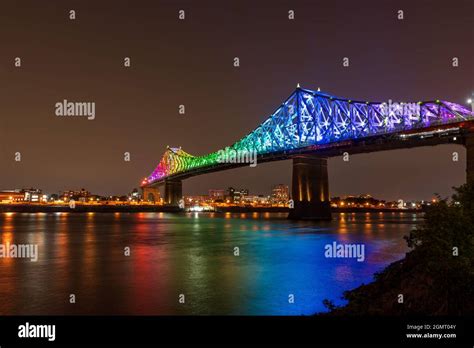 Jacques Cartier Bridge In A Rainbow Lighting At Night Montreal Quebec