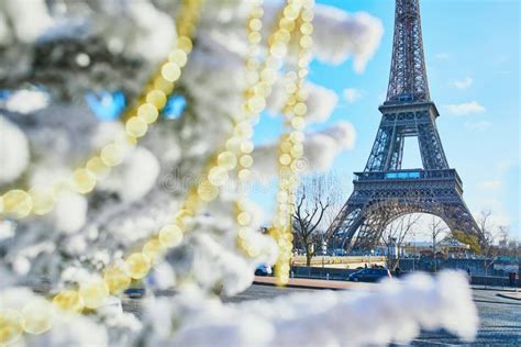 Christmas Tree Covered With Snow Near The Eiffel Tower Stock Image