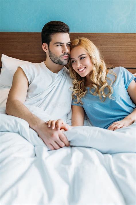 heterosexual couple holding hands stock image image of casual room 129252549