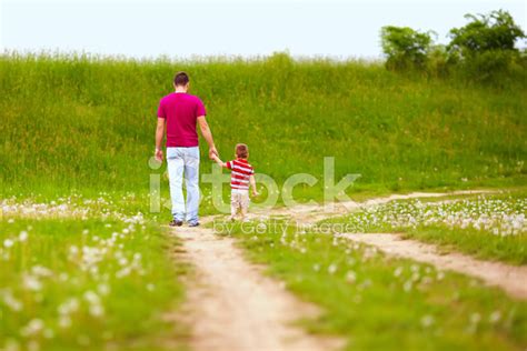 Father And Son Walking Rural Footpath Stock Photo Royalty Free
