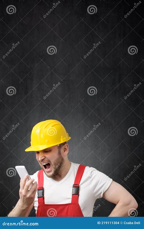 A Construction Worker Shouting On The Phone Stock Photo Image Of