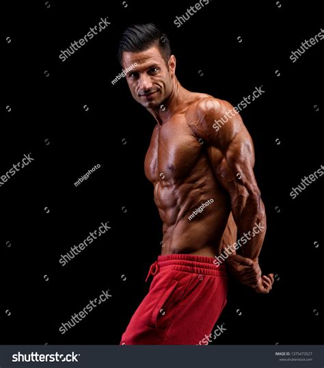 Handsome Muscular Men Flexing Muscles Stock Photo 1375473527 Shutterstock