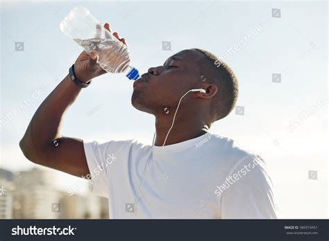 Young Black Man Drinking Water During Stock Photo Edit Now 389319451