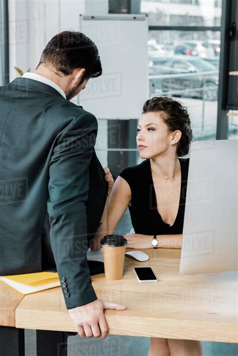 Babe Seductive Businesswoman Flirting With Colleague At Workplace In Office Stock Photo
