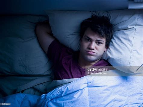 Man Lying Awake In Bed Stock Photo Getty Images