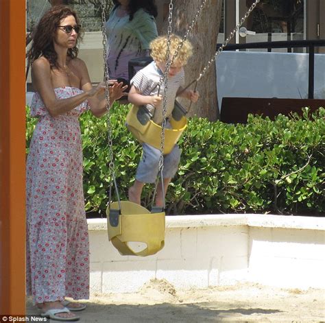 Minnie Drivers Curly Haired Cutie Henry Swings Into Action At The Playground Daily Mail Online