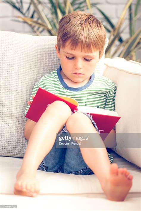 Young Boy Reading A Book High Res Stock Photo Getty Images