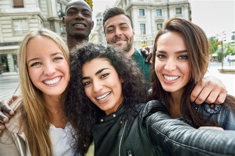 Free Photo Multiracial Group Of Young People Taking Selfie