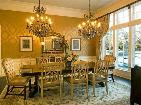 Elegant Yellow Gold Victorian Dining Room Featuring Double Chandeliers