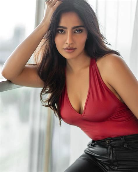 Neha Sharma Looks Stunning In A Red Halter Neck Top And Black Satin Pants Moviekoop