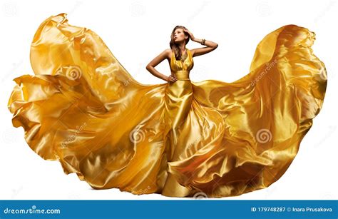 Woman In Fluttering Gold Dress On White Waving Silk Cloth Artistic Fashion Model In Golden