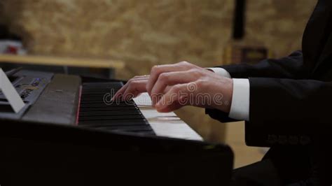 Men Pianist Plays Gentle Clerical Music On A Beautiful Grand Piano With
