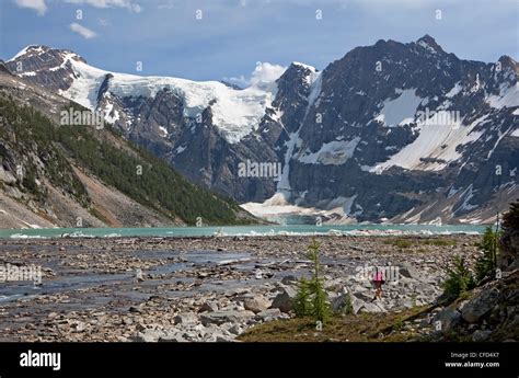 Hiker At Lake Of The Hanging Glacier Purcell Mountains British