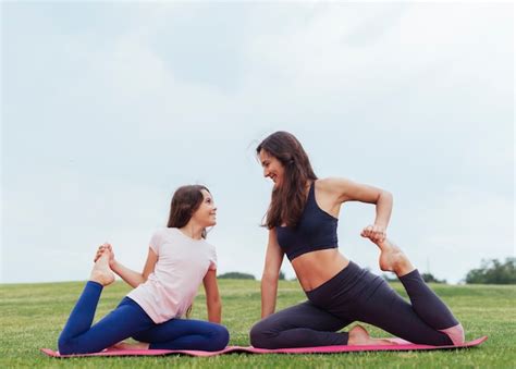 Free Photo Mother And Daughter Doing Exercises Outdoors