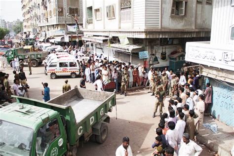 rescue efforts at lyari building collapse pakistan dawn