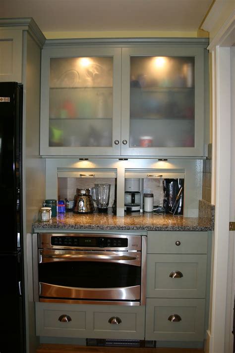 Since the corner cabinet is deep and the opening is narrow, it is your kitchen's trickiest area. Cabinet unit with extra deep appliance garage recessed into wall beyond. | Appliance garage ...