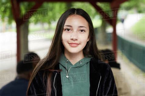 Portrait Confident Female Teenage Girl At Park Stock Photo Dissolve