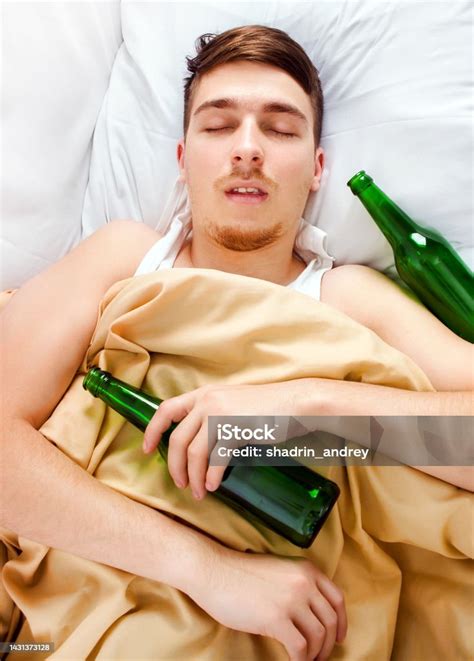 Young Man Sleeping With A Beer Stock Photo Download Image Now 25 29