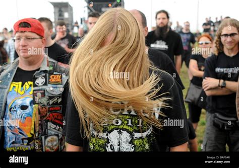 Heavy Metal Fans Are Pictured While Head Banging At The Music Festival