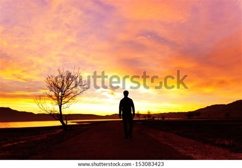 Man Walking Sunset On Mountain Lake Stock Photo 153083423 Shutterstock