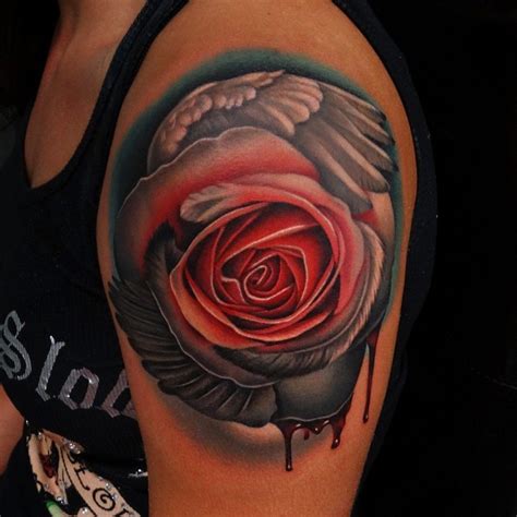 Unusual Combined Big Bloody Colored Rose With Angel Wing Tattoo On