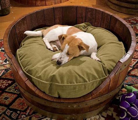 It is handcrafted from reclaimed wine barrels and gives your dog enough room to relax. Wine Barrel Dog Bed | HiConsumption