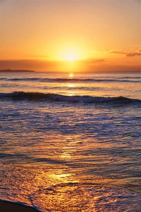 Sun Rises Over Horizon Dawn Sea Ocean At Sunset Sandy Beach Wave On