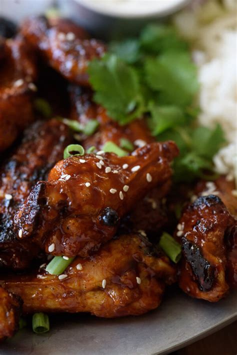 These tasty wings are boiled, dried, and then baked in the oven. Sticky Honey Garlic Sauce | The Adventure Bite