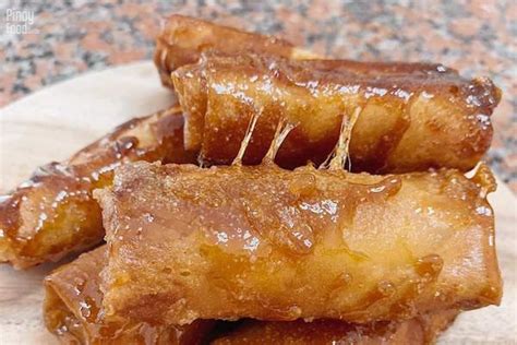 The famous afternoon snack is traditionally stuffed with plantain (banana) and dusted with brown sugar . Basic Turon Recipe | Pinoy Food Guide