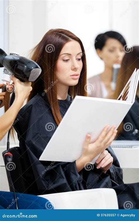 Beautician Does Hair Style For Woman In Hairdressing Salon Stock Image