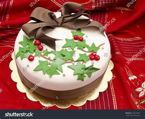 3 decorating your frosted christmas cake. Christmas Cake Decorated With Fondant Holly Leaves Stock ...