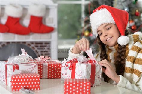 Close Up Portrait Of Girl In Santa Hat With Ts Stock Photo Image