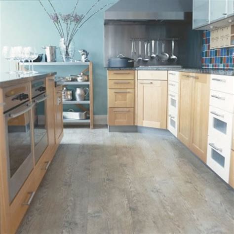 Gorgeous kitchen features light grey upper cabinets and dark brown lower cabinets paired with gray. Special Kitchen Floor Design Ideas - My Kitchen Interior | MYKITCHENINTERIOR