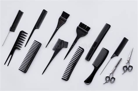 Hairdressing Tools Pattern With Various Combs And Brushes On Grey