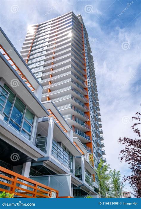 Brand New High Rise Building On Blue And White Sky Background Stock