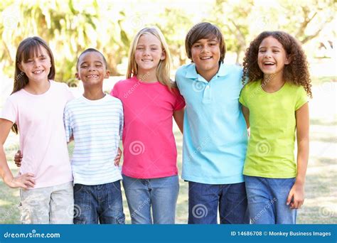 Portrait Of Group Of Children Playing In Park Stock Photo Image Of