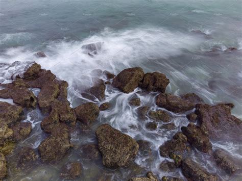 Aerial Top View Of Sea Waves Hitting Rocks High Quality Nature Stock