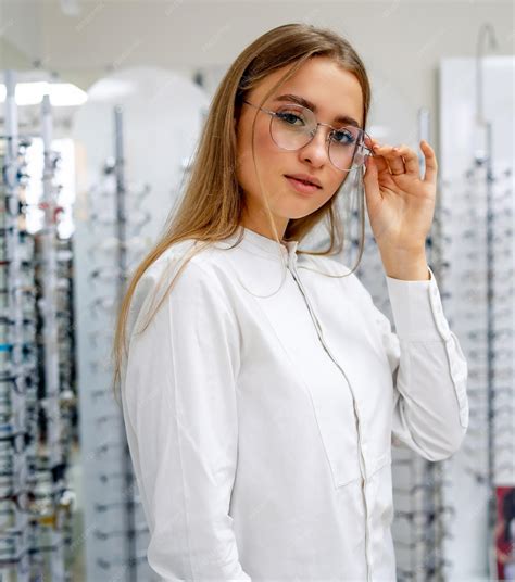 premium photo eyeglasses closeup woman in spectacles choosing glasses client in optics