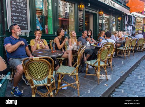 Paris France Crowd Tourists Women Sharing Drinks In French Bistro