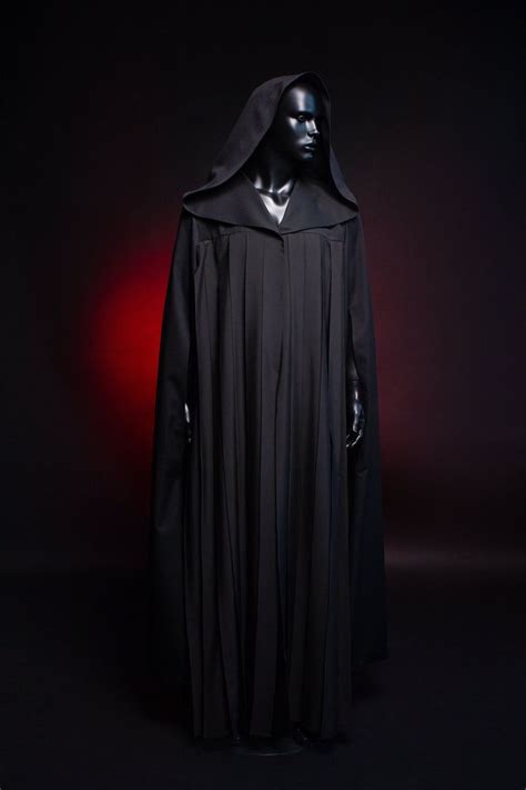 darth vader costume from star wars the old republic on display in a dark room
