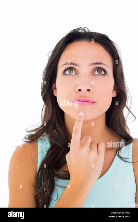 Pretty Brunette Looking Up Thoughfully Stock Photo Alamy