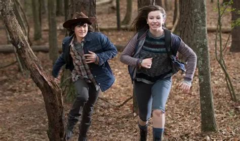 rollerskating and romance does love mean death for carl and enid on the walking dead horror