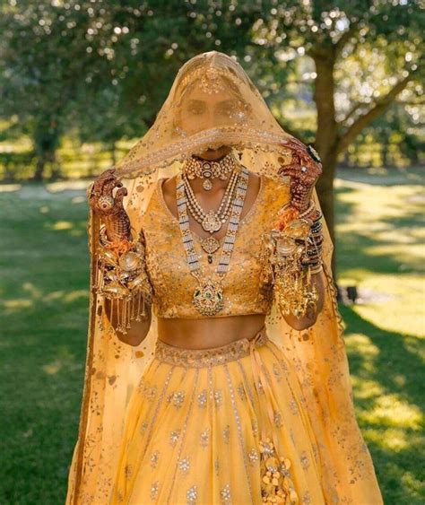 Stunning Sabyasachi Yellow Lehenga With Exquisite Jewellery Shaadiwish