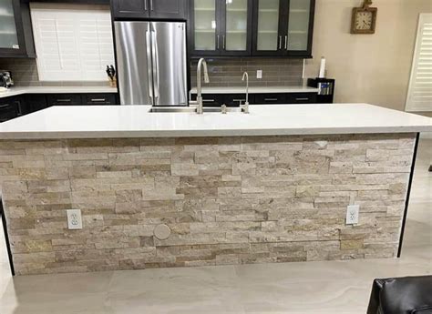 Kitchen With Stacked Stone Island White Quartz Countertop Dark Wood Cabinets 800x583 