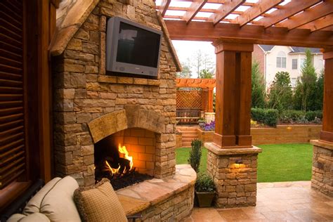 If your going into an uneven stone surface? Outdoor Stacked Stone Fireplace with TV Mount with ...